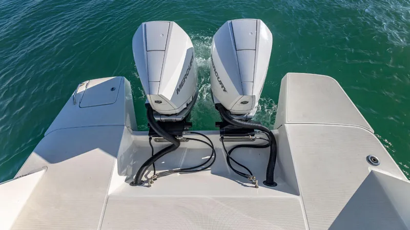 Slide: The Image of 2021 Beneteau Gran Turismo 32 with dual outboard motors on water. - 14