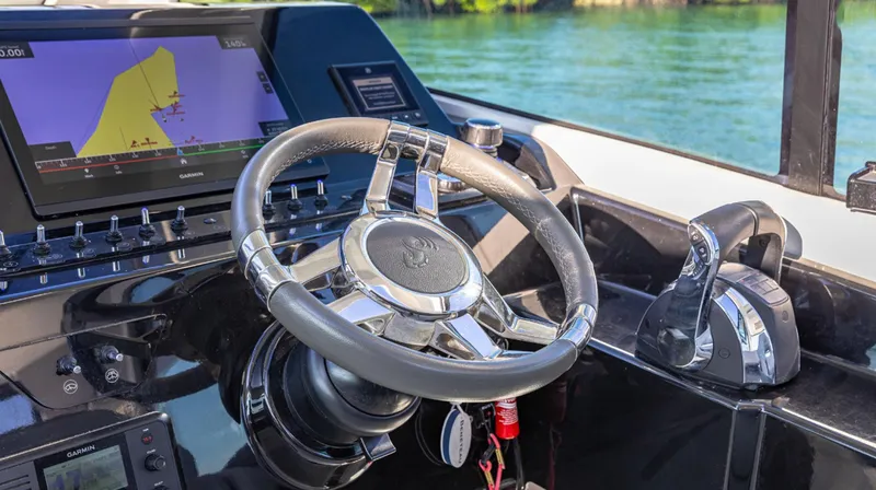 Slide: The Image of Steering wheel and controls of 2021 Beneteau Gran Turismo 32 yacht. - 8