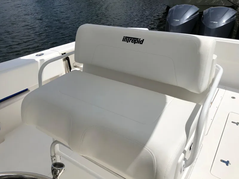 Slide: The Image of 2008 Intrepid 370 boat seat with logo, featuring dual outboard motors in the background. - 10