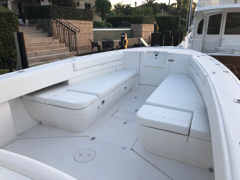 Slide: The Image of 2008 Intrepid 370 boat interior with white seating and spacious deck. - 3