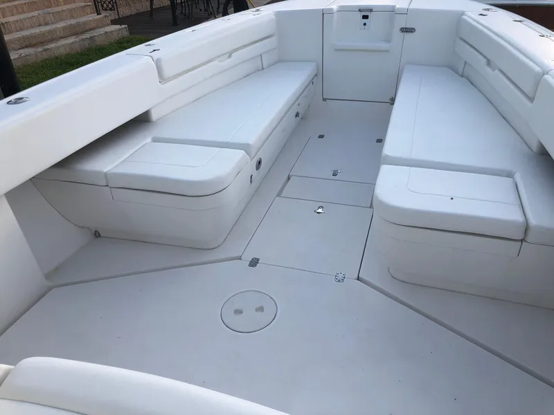 Slide: The Image of 2008 Intrepid 370 boat interior with spacious seating and clean white design. - 4