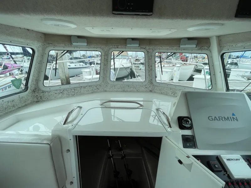 Slide: The Image of Interior view of 2016 Farallon 3200 Explorer boat with Garmin navigation system. - 12