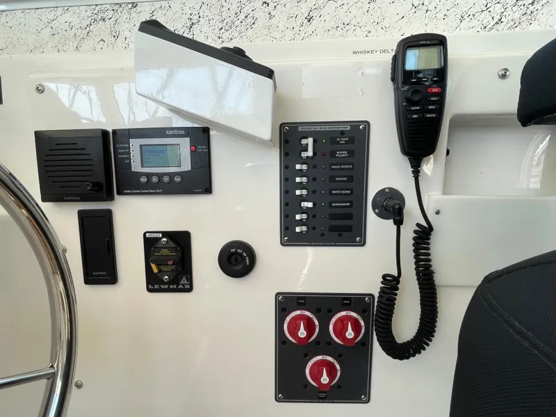 Slide: The Image of Control panel of a 2016 Farallon 3200 Explorer boat with various instruments and switches. - 15