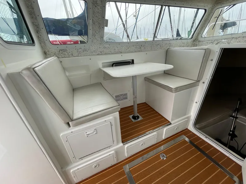 Slide: The Image of Farallon 3200 Explorer 2016 interior with seating and table, featuring wood-patterned flooring. - 19