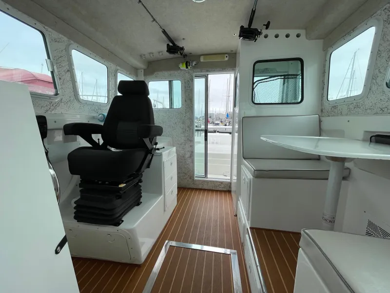Slide: The Image of Interior of 2016 Farallon 3200 Explorer boat with seating and table. - 21
