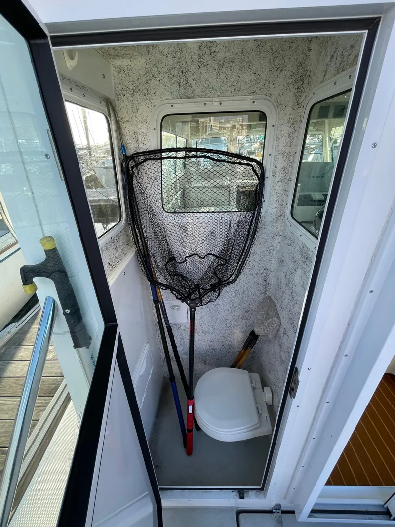 Slide: The Image of Interior of 2016 Farallon 3200 Explorer with fishing net and toilet. - 23
