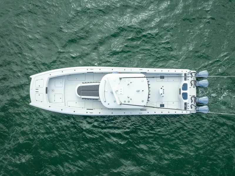 Slide: The Image of Aerial view of 2017 Freeman 42 boat on green water. - 13