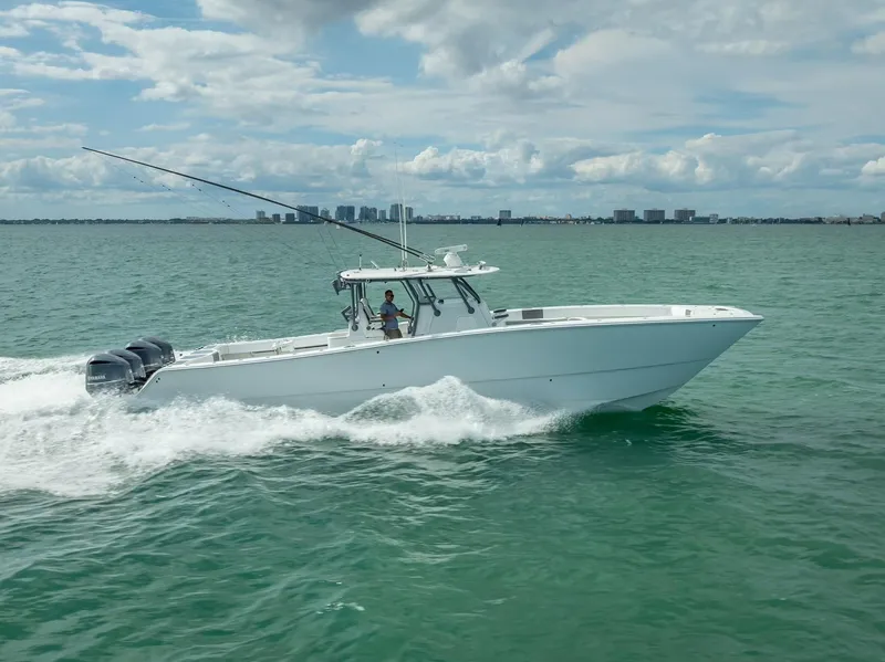 Slide: The Image of 2017 Freeman 42 boat cruising on open water under a cloudy sky. - 14