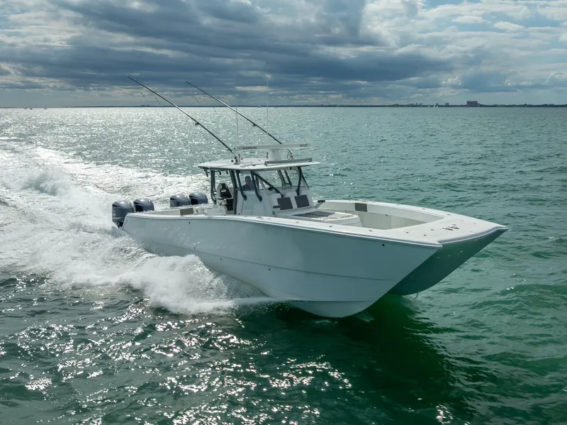 Slide: The Image of 2017 Freeman 42 boat cruising on open water under cloudy skies. - 18