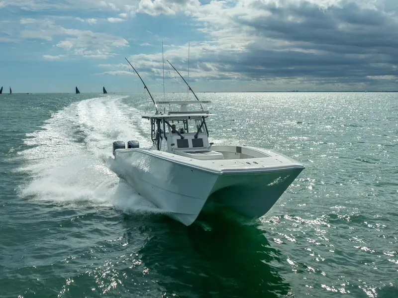 Slide: The Image of 2017 Freeman 42 boat cruising on open water under a cloudy sky. - 19