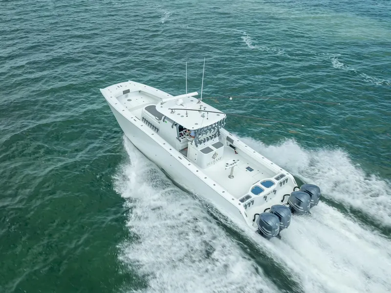 Slide: The Image of 2017 Freeman 42 boat cruising on open water with twin engines. - 22