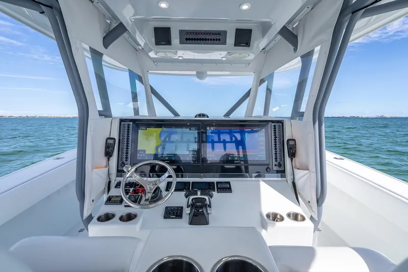 Slide: The Image of Freeman 42 boat cockpit, 2017 model, featuring advanced navigation systems and steering controls. - 23