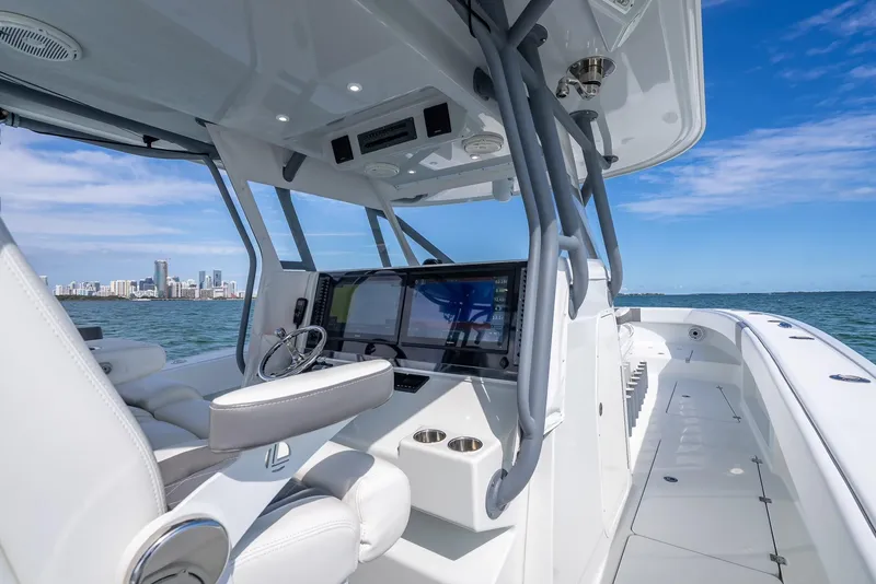 Slide: The Image of 2017 Freeman 42 boat interior with modern helm, ocean view, and city skyline. - 25