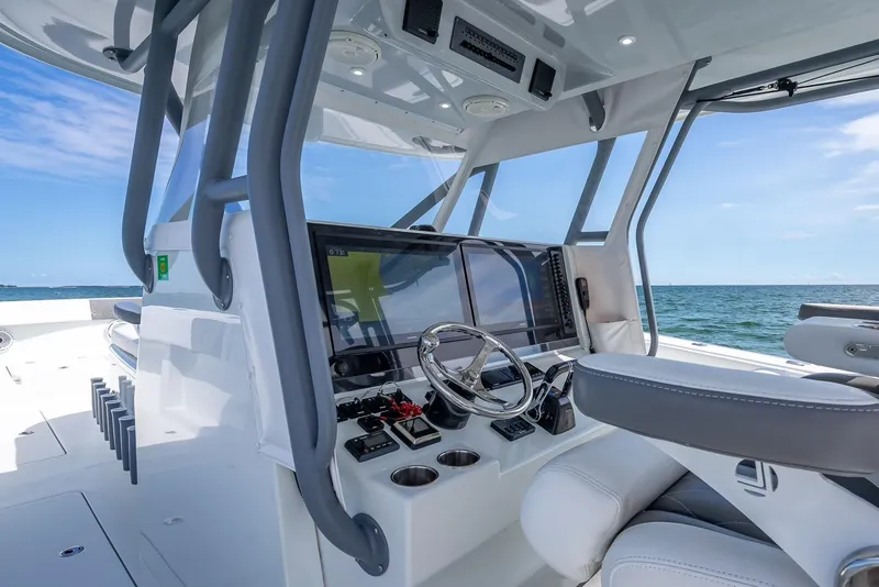 Slide: The Image of 2017 Freeman 42 boat cockpit with modern controls and ocean view. - 27