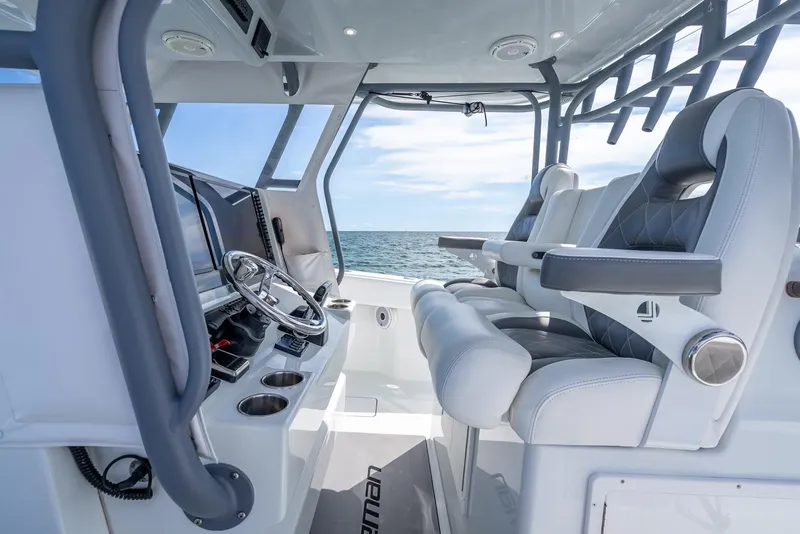 Slide: The Image of Interior of 2017 Freeman 42 boat with modern helm and seating, ocean view. - 30