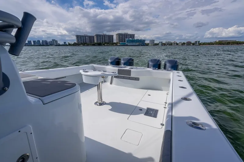 Slide: The Image of Freeman 42 boat, 2017 model, on water with city skyline in background. - 32