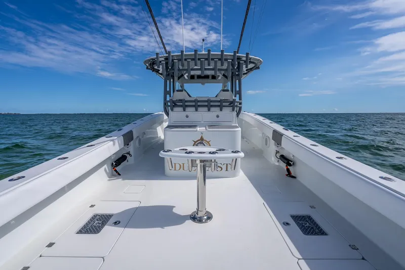 Slide: The Image of 2017 Freeman 42 boat on open water under clear blue sky. - 33