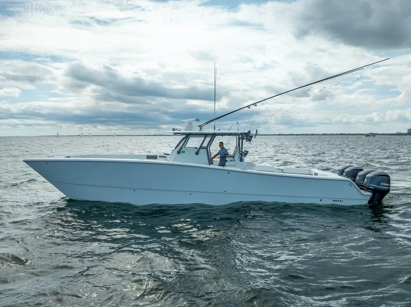 Slide: The Image of 2017 Freeman 42 boat on open water under cloudy sky. - 4