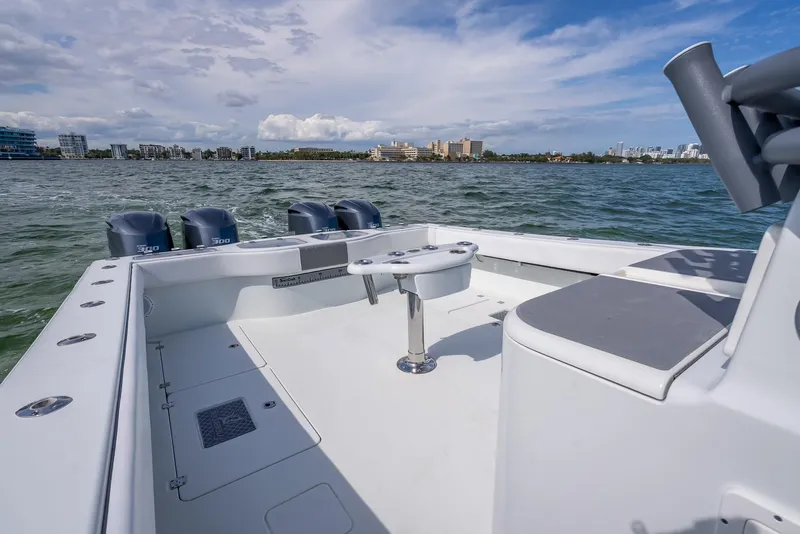 Slide: The Image of Freeman 42 boat deck, 2017 model, with multiple outboard engines on a sunny day. - 44