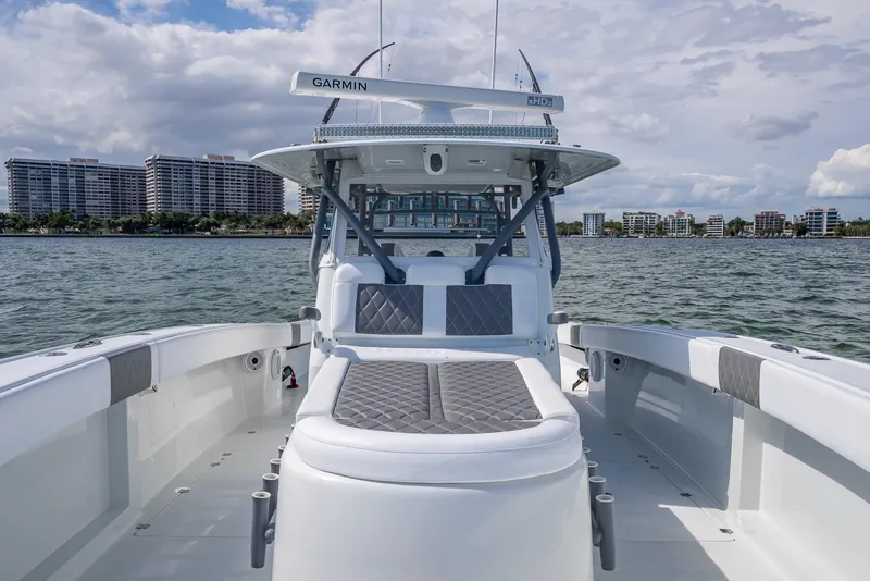 Slide: The Image of 2017 Freeman 42 boat on water, featuring spacious deck and modern design. - 48