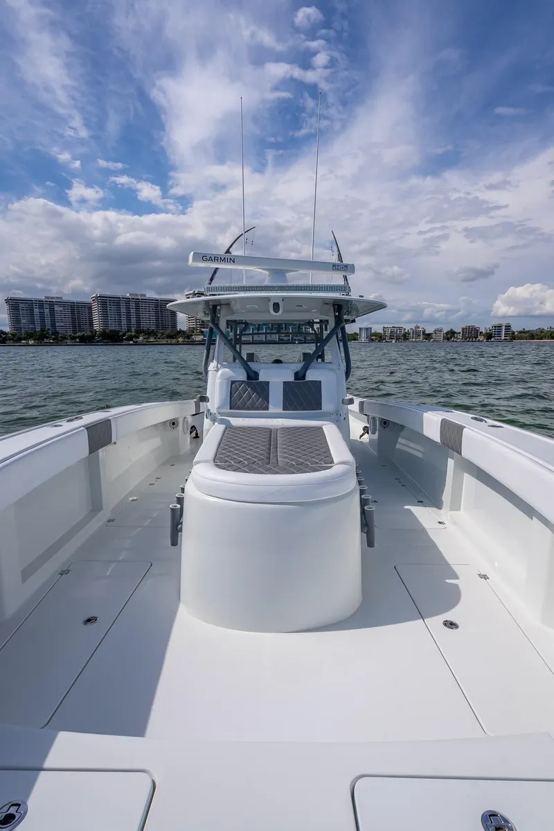 Slide: The Image of Freeman 42 boat, 2017 model, on water with cloudy sky background. - 49