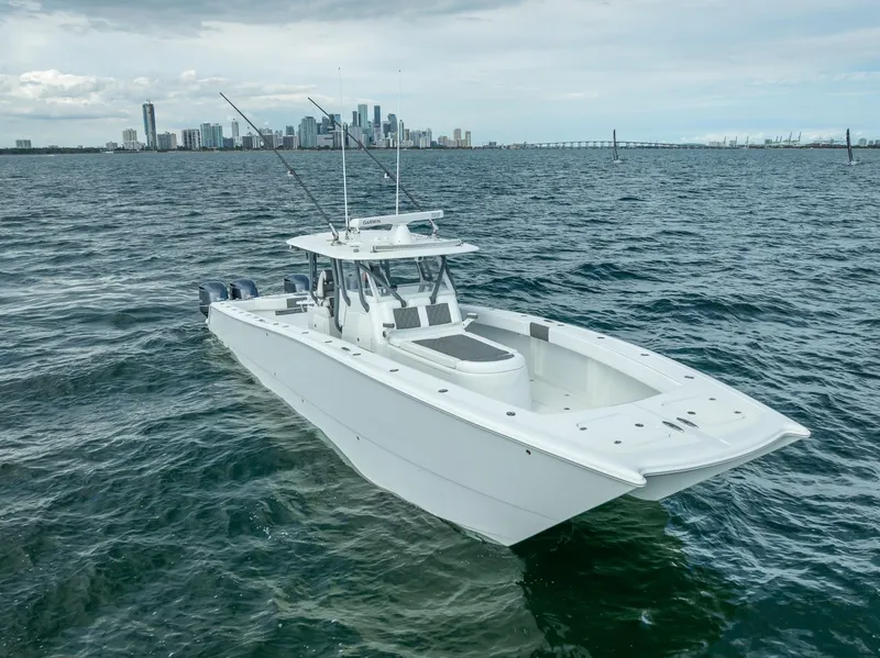 Slide: The Image of 2017 Freeman 42 boat on open water with city skyline in background. - 6