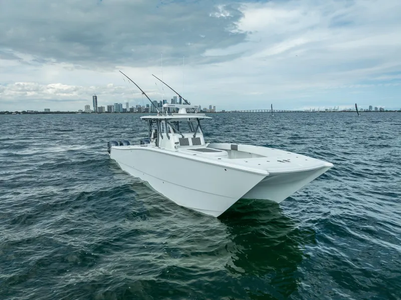 Slide: The Image of 2017 Freeman 42 boat on open water with city skyline in background. - 8
