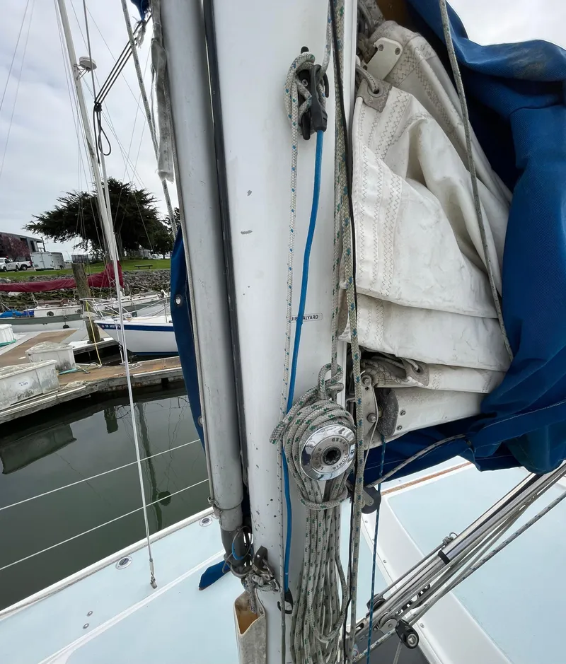 Slide: The Image of Close-up of a 1984 Catalina 30 sailboat mast and rigging at a marina. - 18