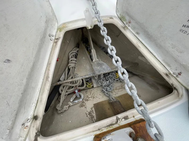 Slide: The Image of Anchor locker of 1984 Catalina 30 sailboat with chain and rope storage. - 20
