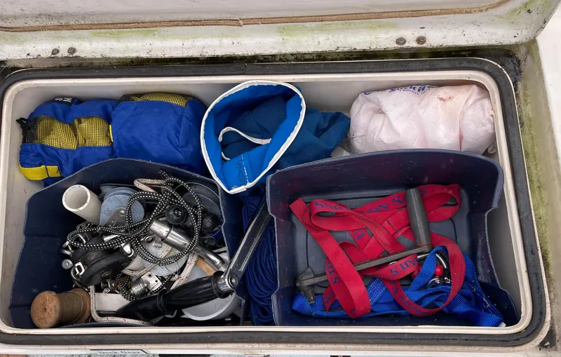 Slide: The Image of Cushions from a 1984 Catalina 30 sailboat, placed on a blue fabric surface. - 22