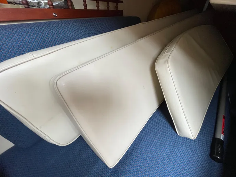 Slide: The Image of 1984 Catalina 30 sailboat docked in a marina, surrounded by other boats. - 23