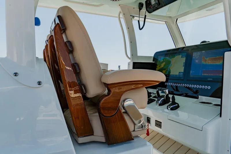 Slide: The Image of Luxurious Freeman 38 boat cockpit with leather seats and advanced navigation system, 2025 model. - 20