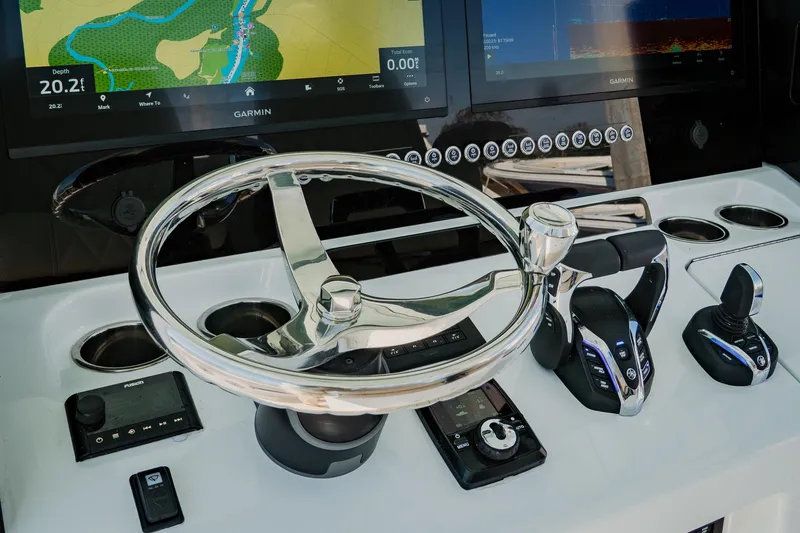 Slide: The Image of Steering console of 2025 Freeman 38 boat with advanced navigation controls and displays. - 23