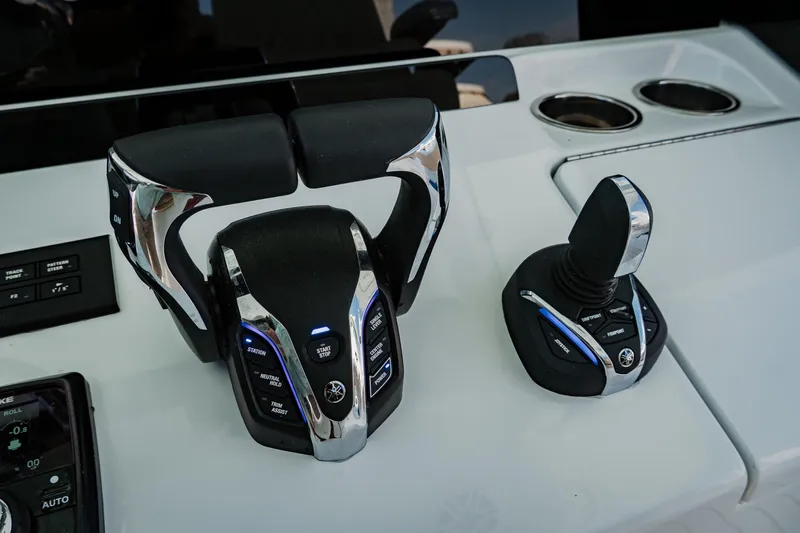 Slide: The Image of Control panel of Freeman 38 boat, featuring advanced throttle and joystick, 2025 model. - 24