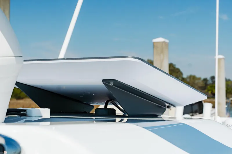 Slide: The Image of Rooftop satellite dish on Freeman 38 boat, 2025 model, docked at marina. - 42