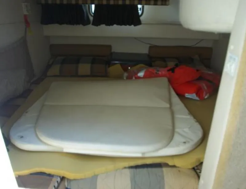 Slide: The Image of Interior cabin of 2004 Monterey 322 Cruiser with cushions and life jackets. - 15