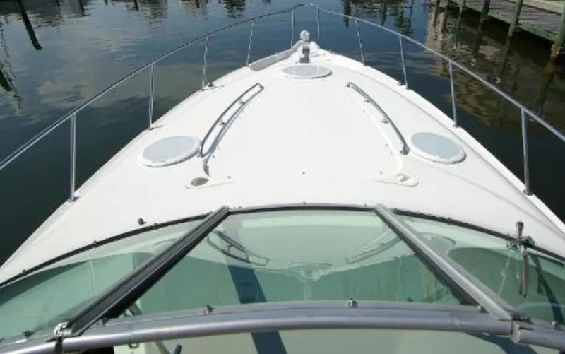 Slide: The Image of 2004 Monterey 322 Cruiser boat deck view with railing and hatches. - 7
