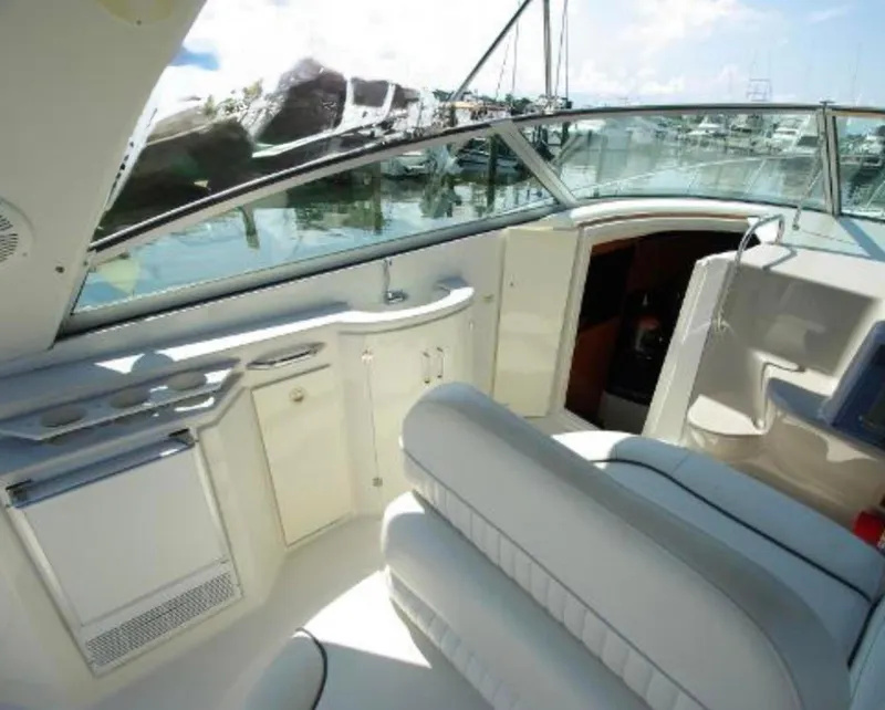 Slide: The Image of 2004 Monterey 322 Cruiser interior with white seating and sleek design. - 8
