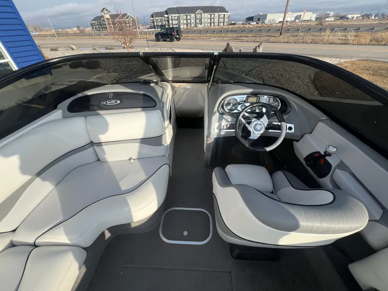 Slide: The Image of 2007 Malibu WVLX boat interior with sleek seating and modern dashboard design. - 11