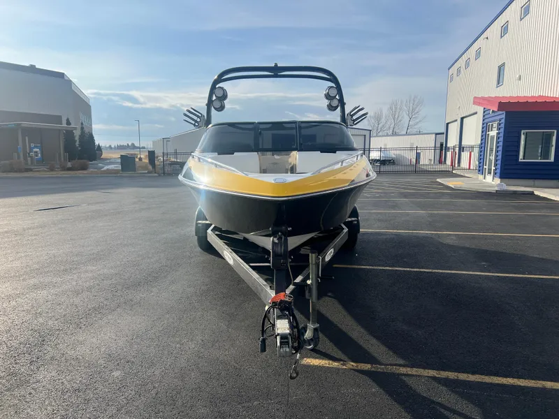 Slide: The Image of 2007 Malibu WVLX boat on trailer in parking lot, sunny day. - 4
