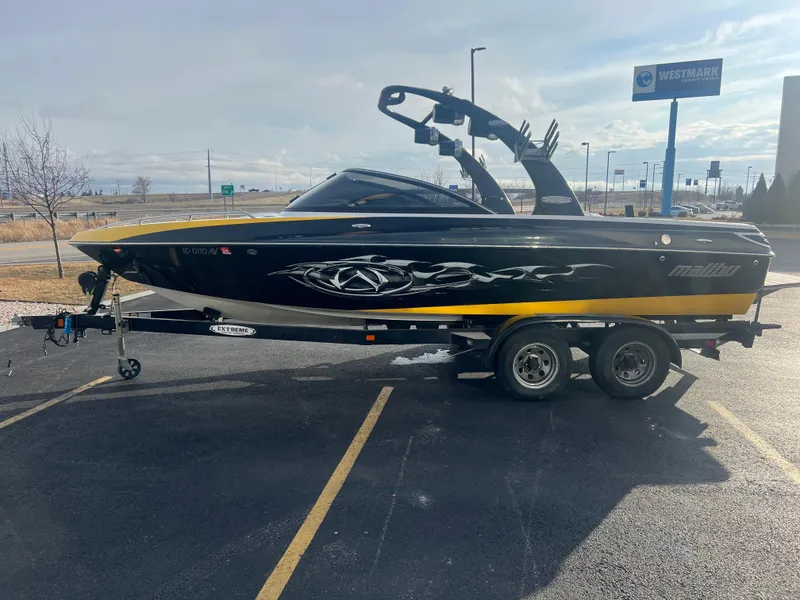 Slide: The Image of 2007 Malibu WVLX boat on trailer in parking lot, side view. - 6