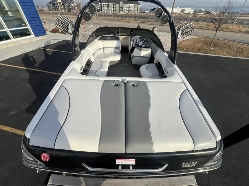 Slide: The Image of 2007 Malibu WVLX boat with sleek interior design, parked outdoors. - 9
