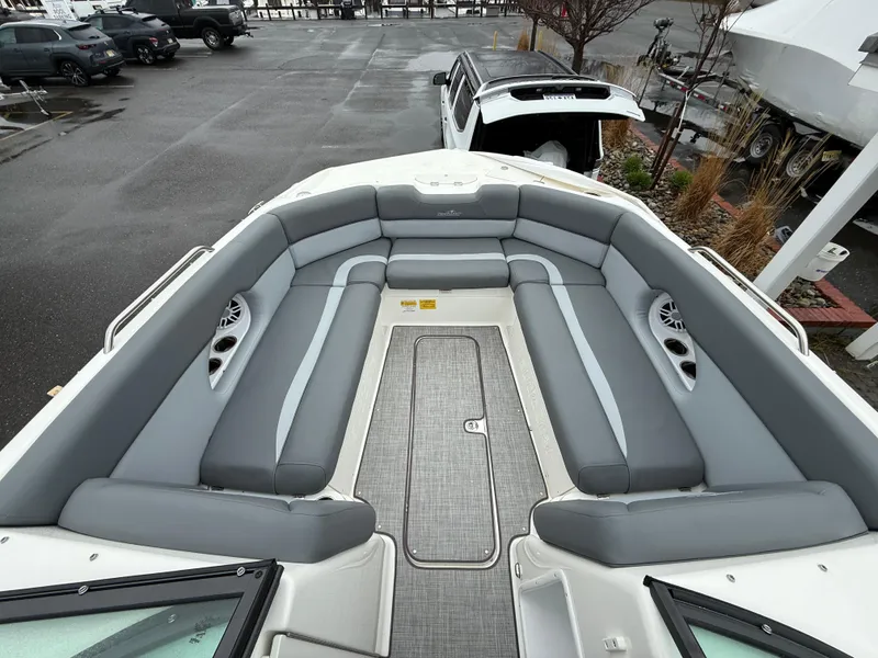 Slide: The Image of 2024 NauticStar 243 DC Deck boat with spacious seating and modern design. - 15