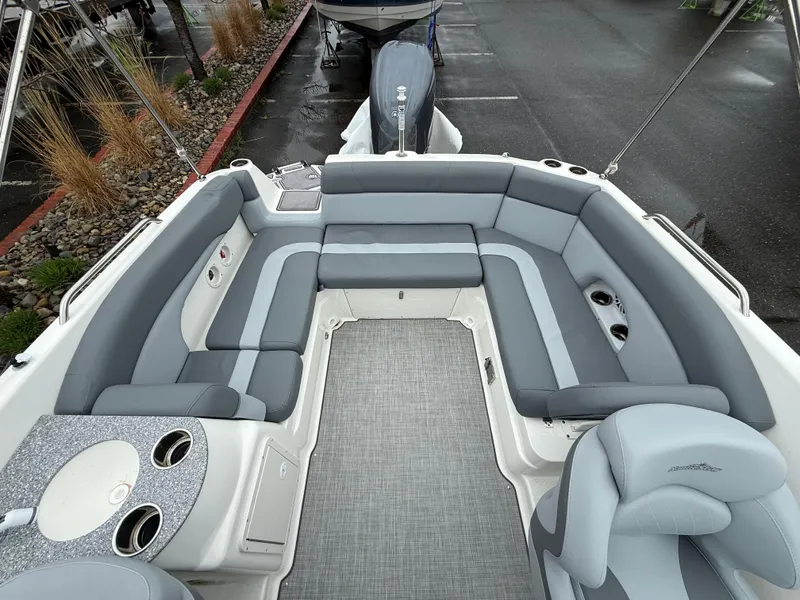 Slide: The Image of 2024 NauticStar 243 DC Deck boat with spacious seating and modern interior design. - 21