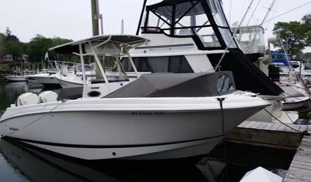 The Image of 2016 Wellcraft 252 Fisherman boat docked in a marina. - 0