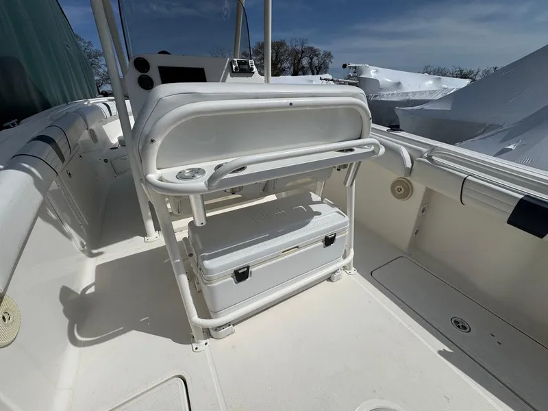 Slide: The Image of 2016 Wellcraft 252 Fisherman boat interior with seating and storage area. - 13
