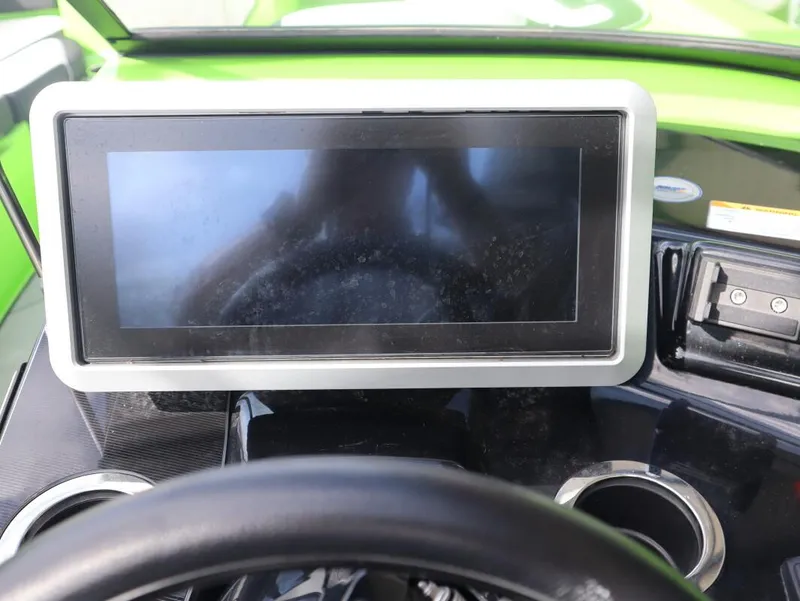 Slide: The Image of Dashboard of 2022 Yamaha Boats 255XD with touchscreen display and steering wheel. - 16