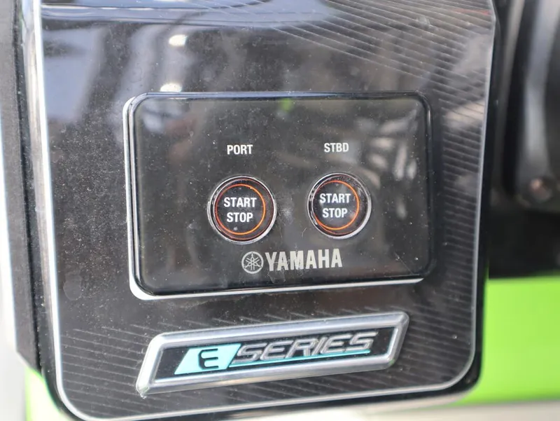 Slide: The Image of Control panel of 2022 Yamaha Boats 255XD with start/stop buttons. - 17