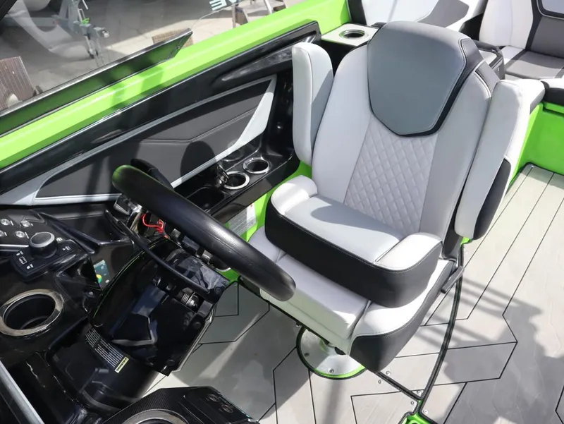 Slide: The Image of Interior of 2022 Yamaha Boats 255XD, featuring a modern helm and comfortable seating. - 20