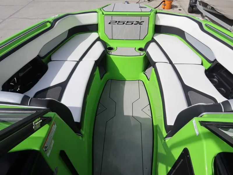 Slide: The Image of 2022 Yamaha Boats 255XD interior with green and white seating, modern design. - 22